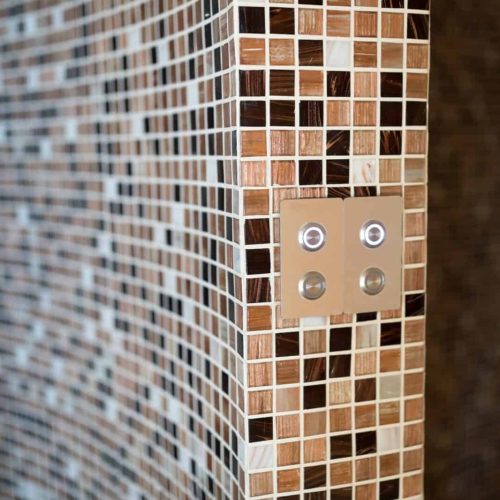 Modern steam bath with mosaic tiles